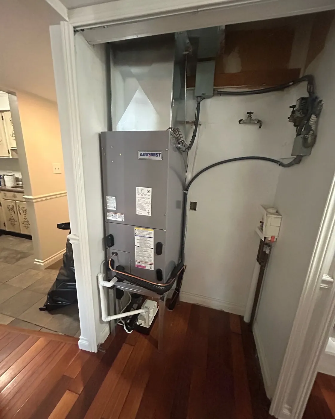 AirQuest air handler installed in an interior closet