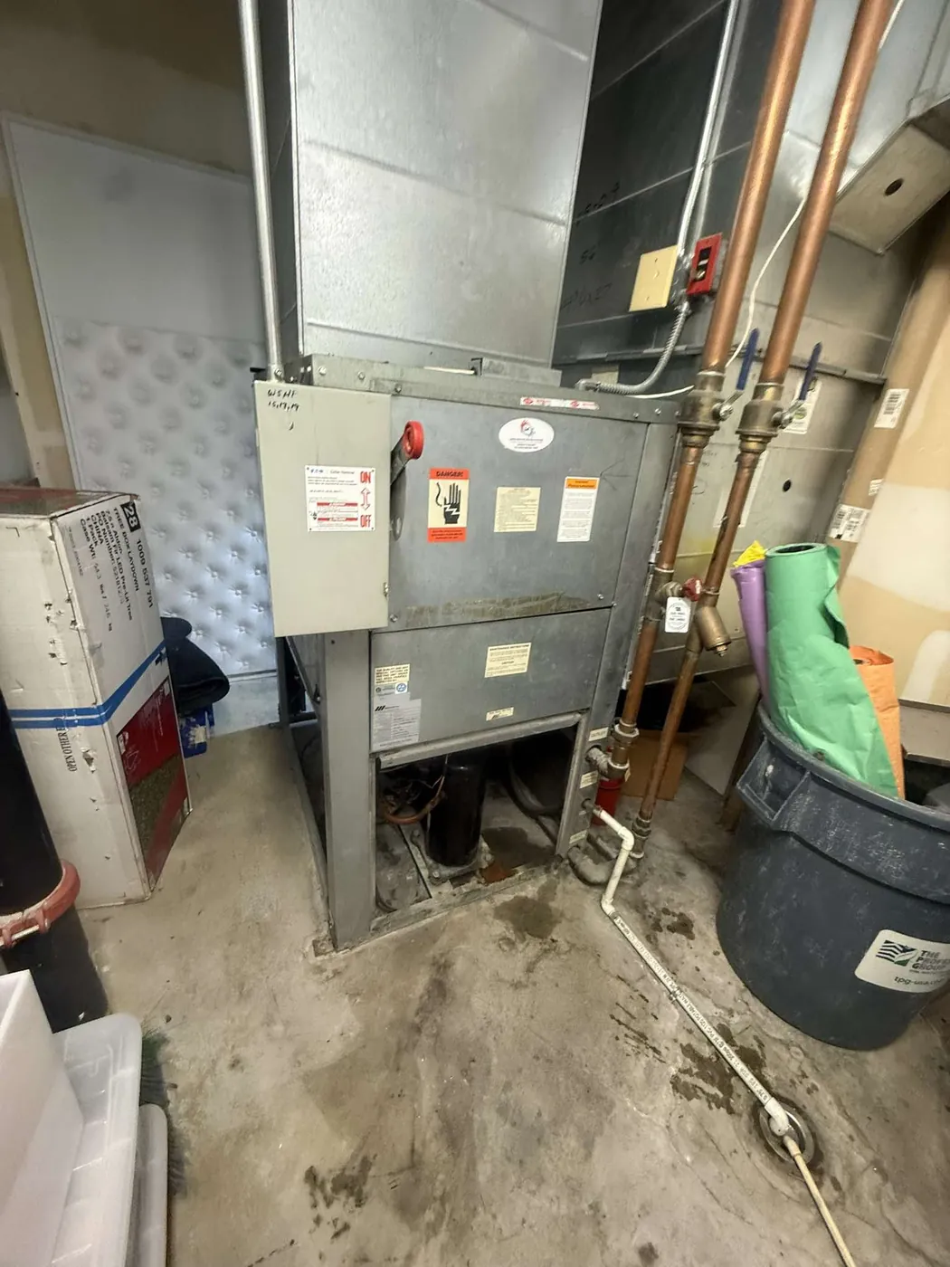 Furnace and water heater servicing in a residential utility room